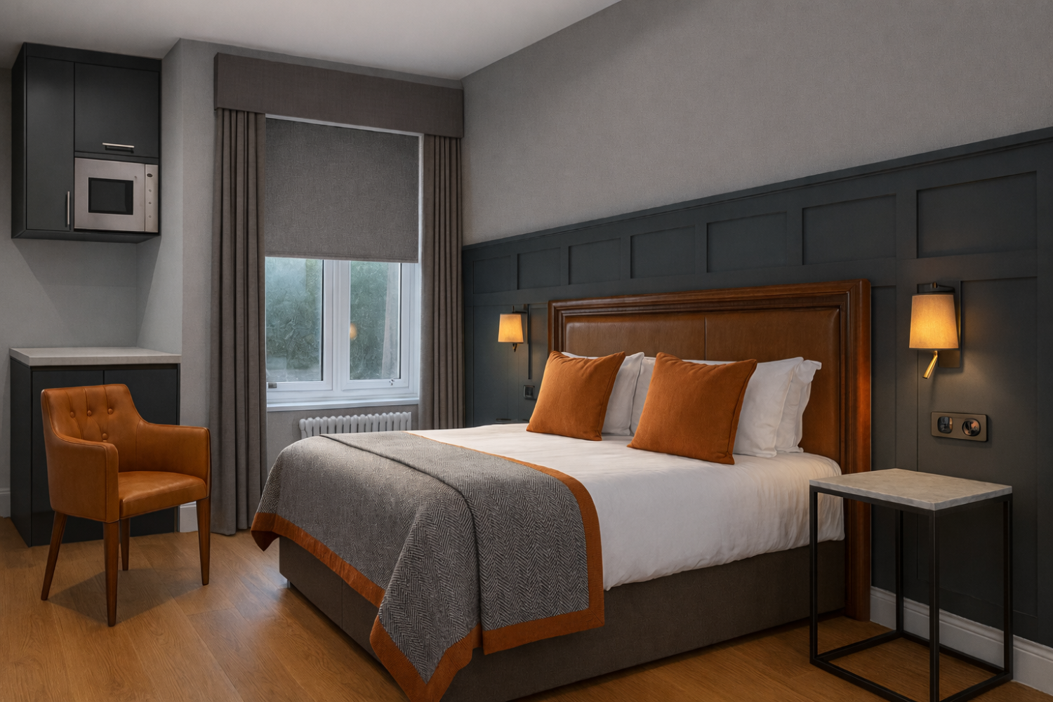 Modern hotel room with a bed, orange armchair, window, and bedside lamps