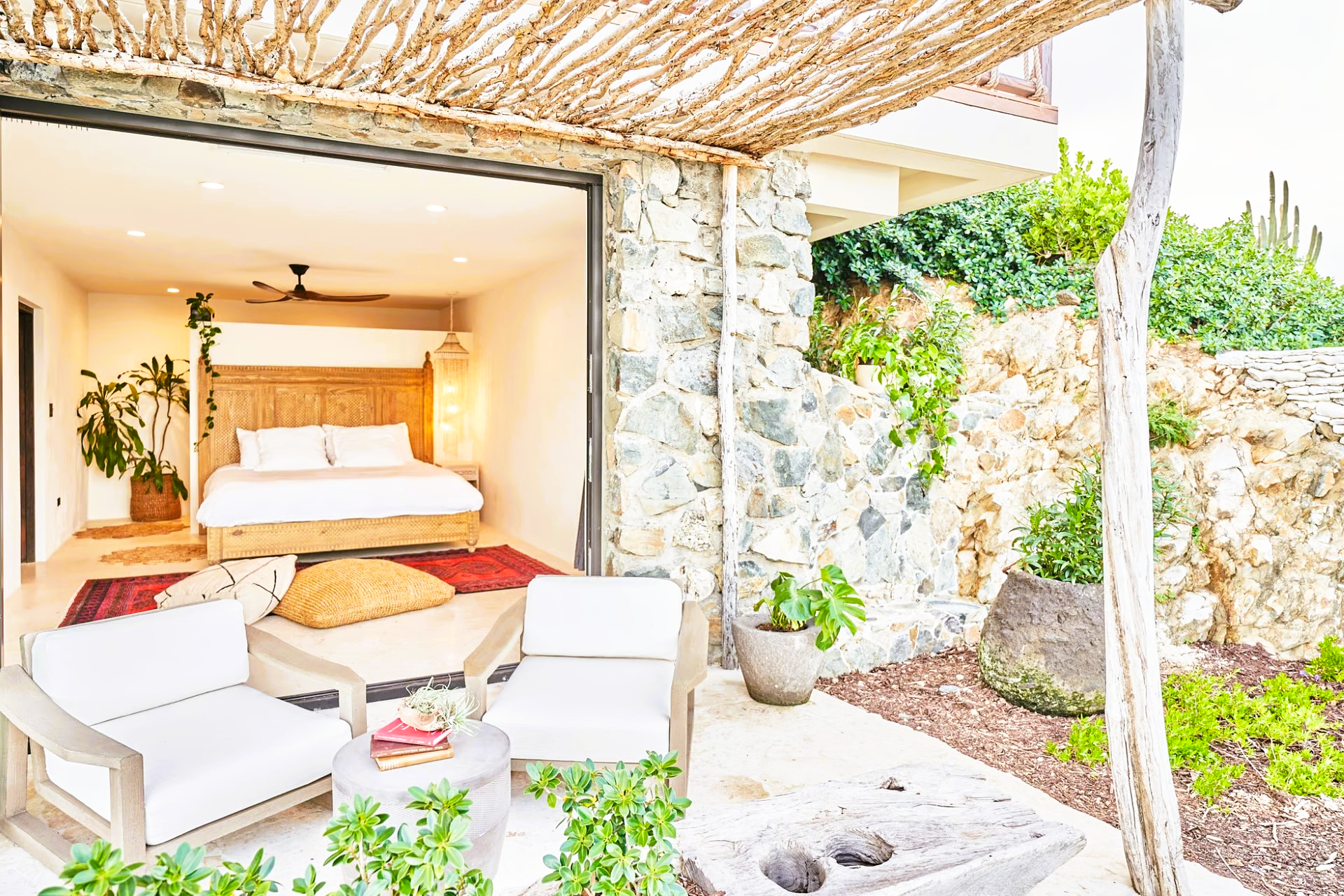 A bedroom with a sliding glass door leading to a patio.
