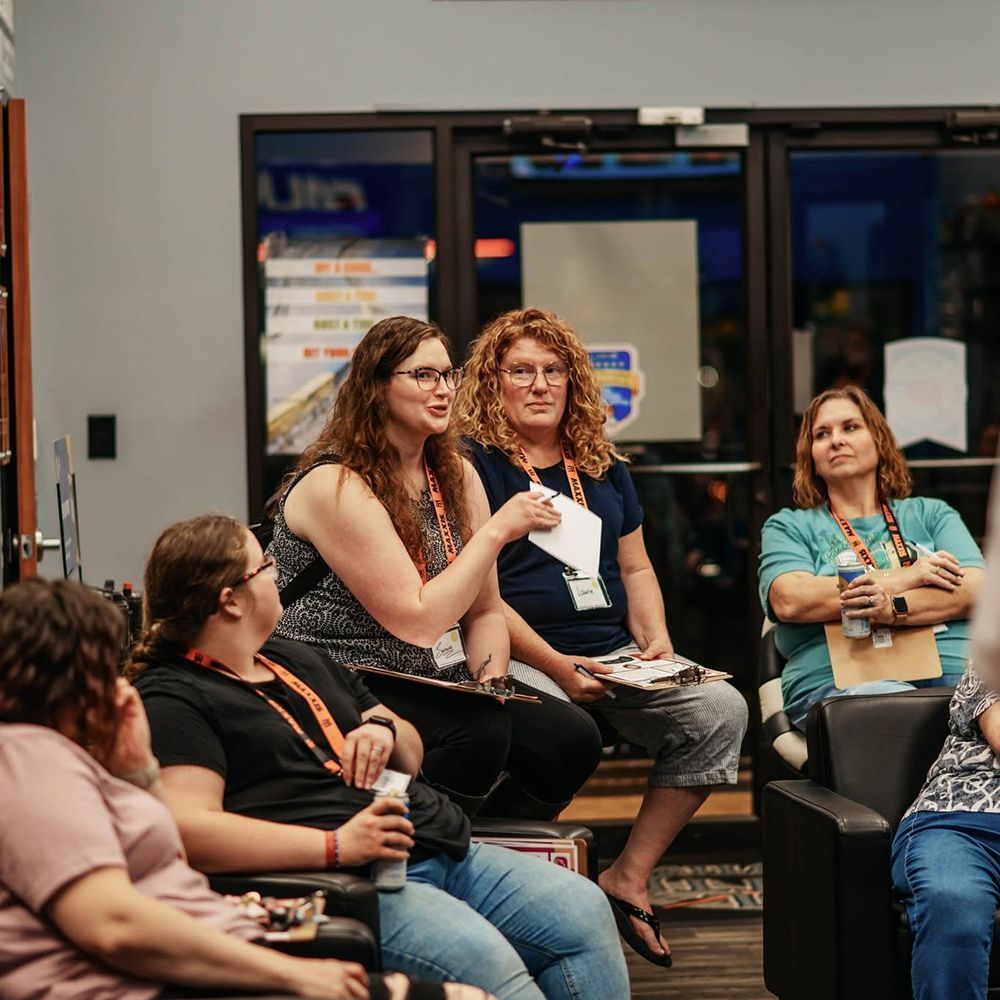 One woman talking as others listen | Full Throttle Automotive LLC