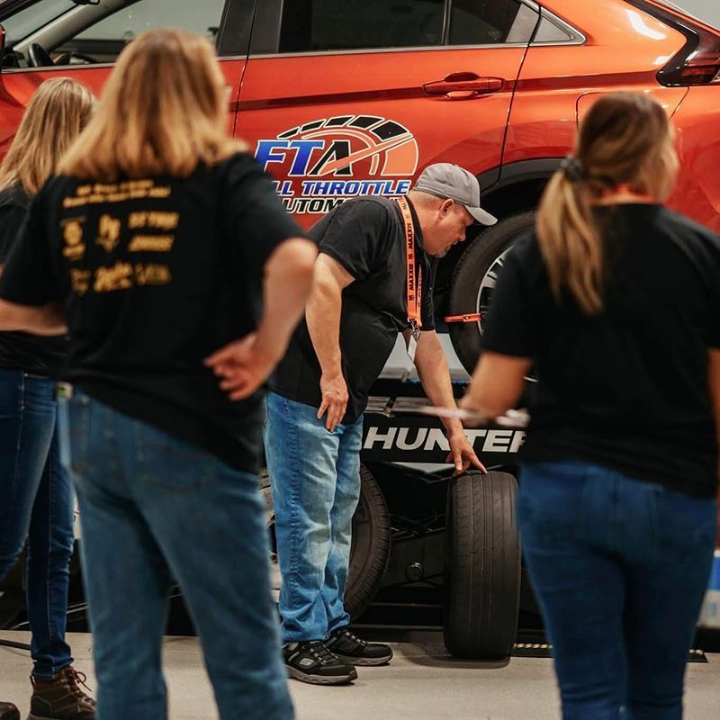 Technician explains the rims of a tire | Full Throttle Automotive LLC