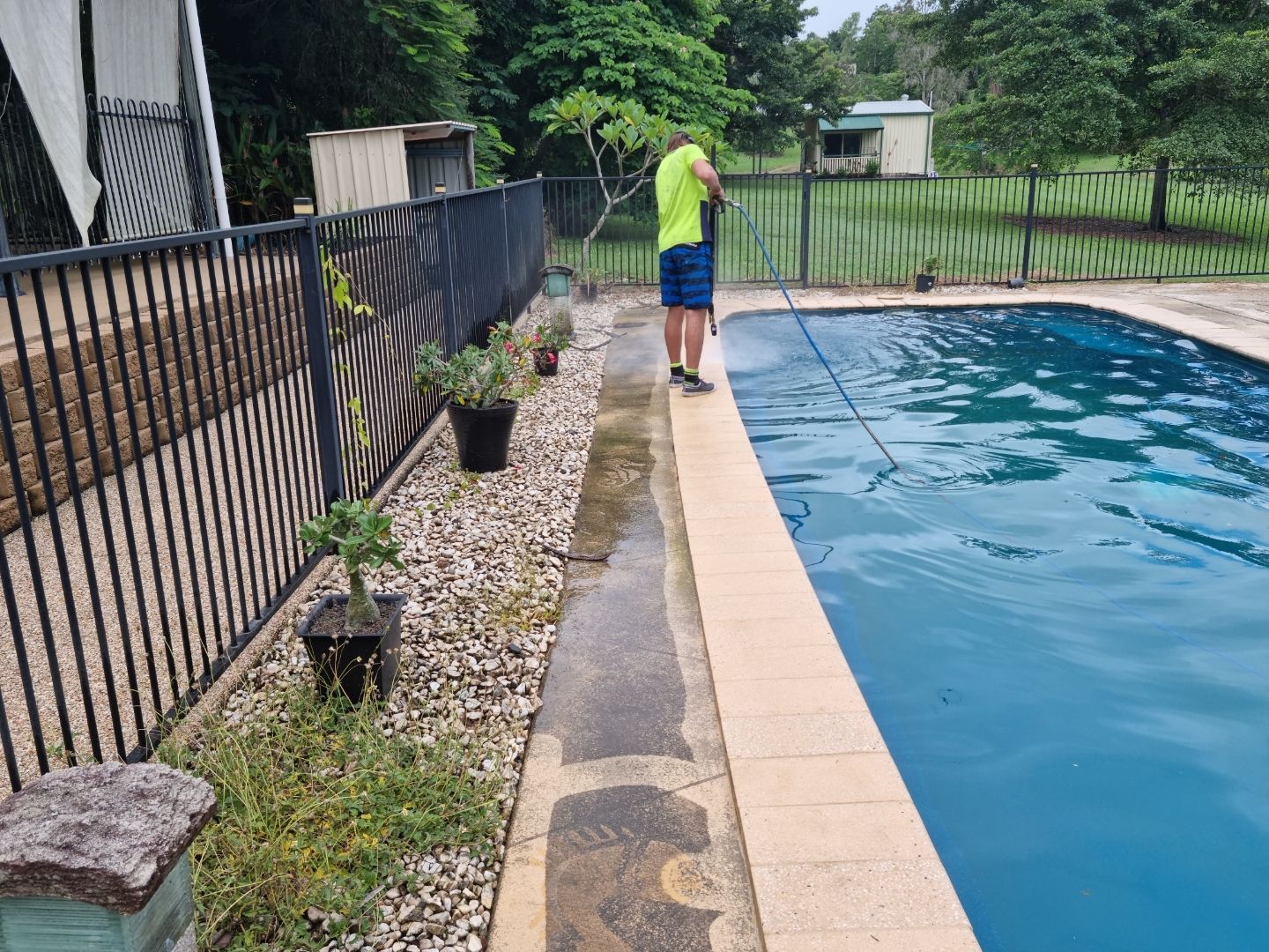 A Person is Cleaning a Tennis Court With a Hose — Blast H2O In Proserpine, QLD