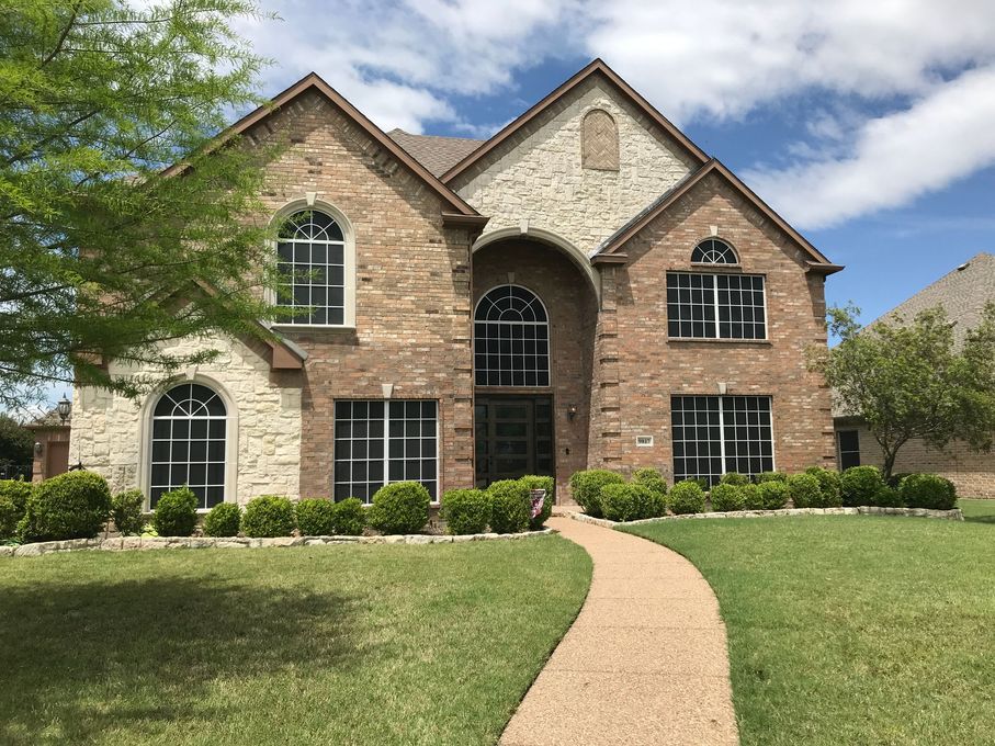 Two-story brick and stone house
