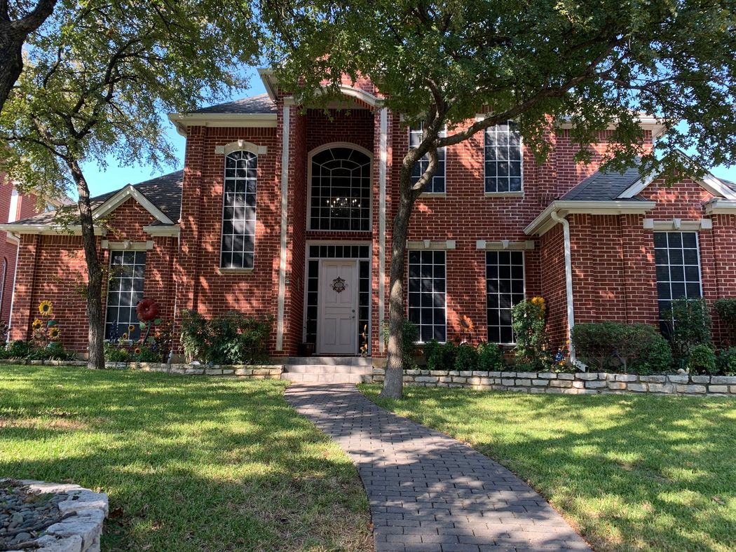 Two-story red brick house