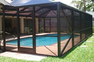 Screened-in backyard pool enclosure