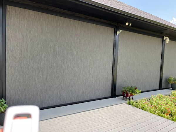 Outdoor motorized solar shades