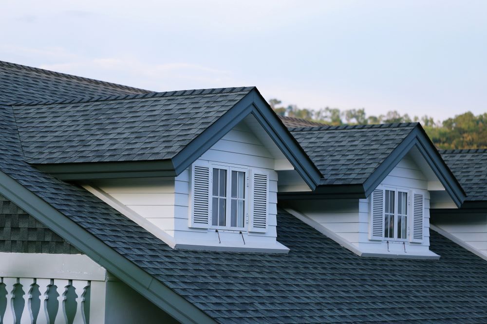 The Roof of a House Has Three Windows on It — East Coast Roof Tiling Services in Kuluin, QLD