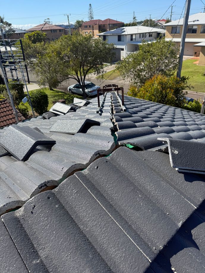 A Close Up of a Row of Tiles on a Roof — East Coast Roof Tiling Services in Kuluin, QLD