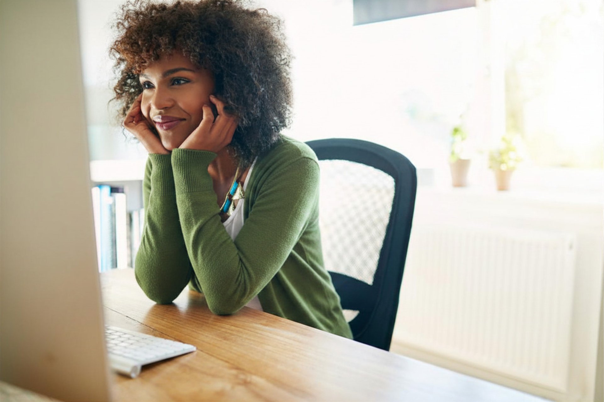 person sitting at desktop