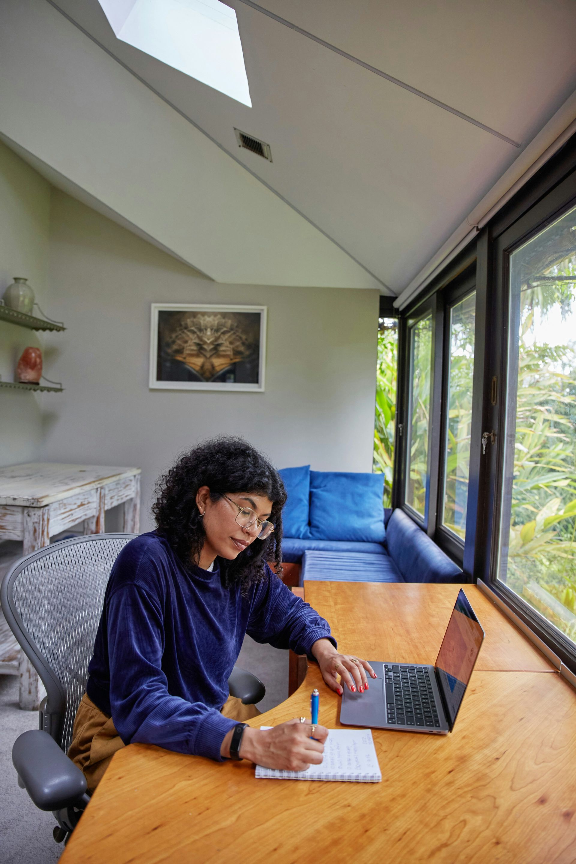 person at laptop writing