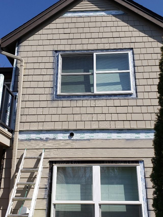A house with a ladder on the side of it