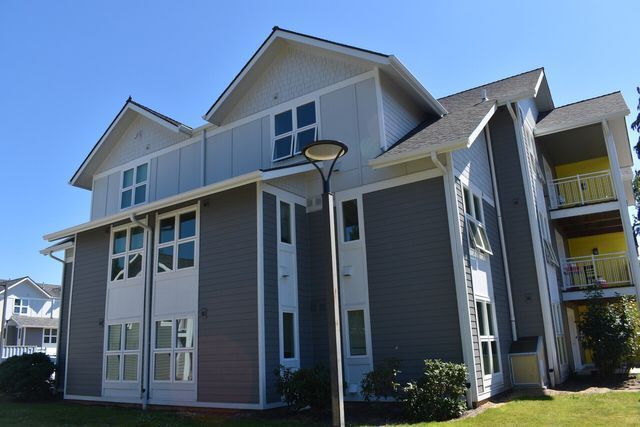 A large house with a lot of windows and a street light in front of it