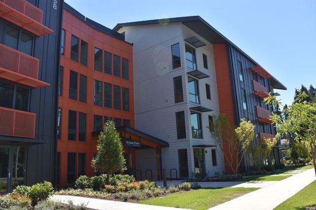 A large apartment building with a lot of windows and balconies