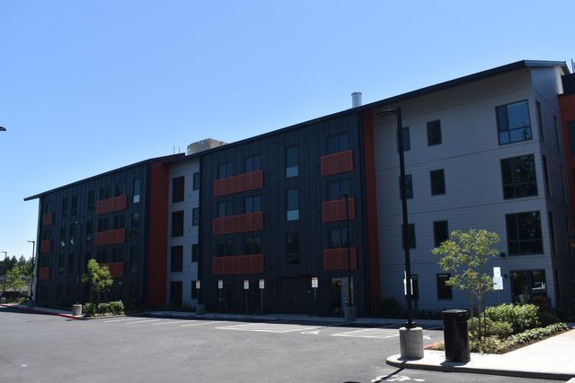 A large apartment building with a lot of windows