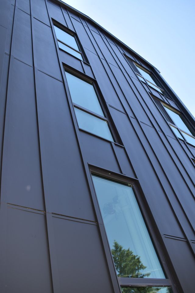 Looking up at a building with a lot of windows