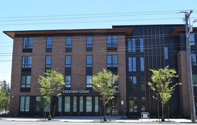 A large brick building with the word crescent court on it