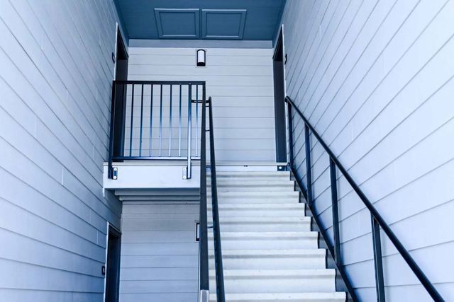 A set of stairs leading up to the second floor of a building.