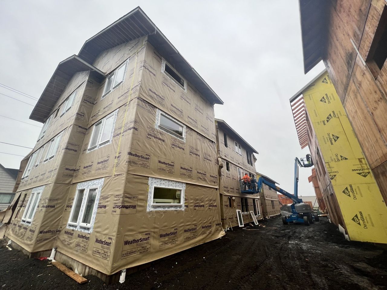 A large building with a lot of windows is being built.