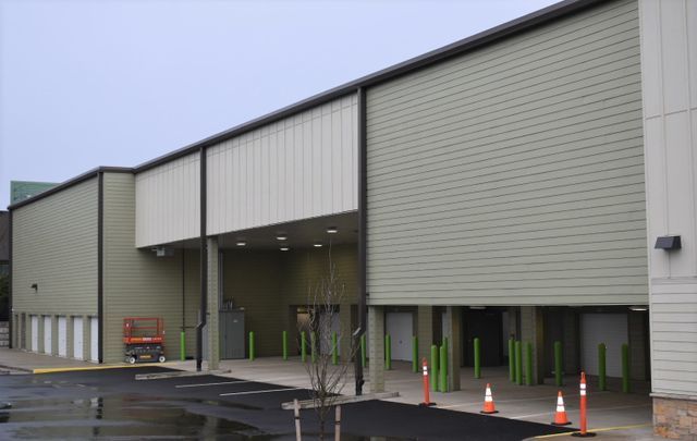 A large building with a parking lot in front of it