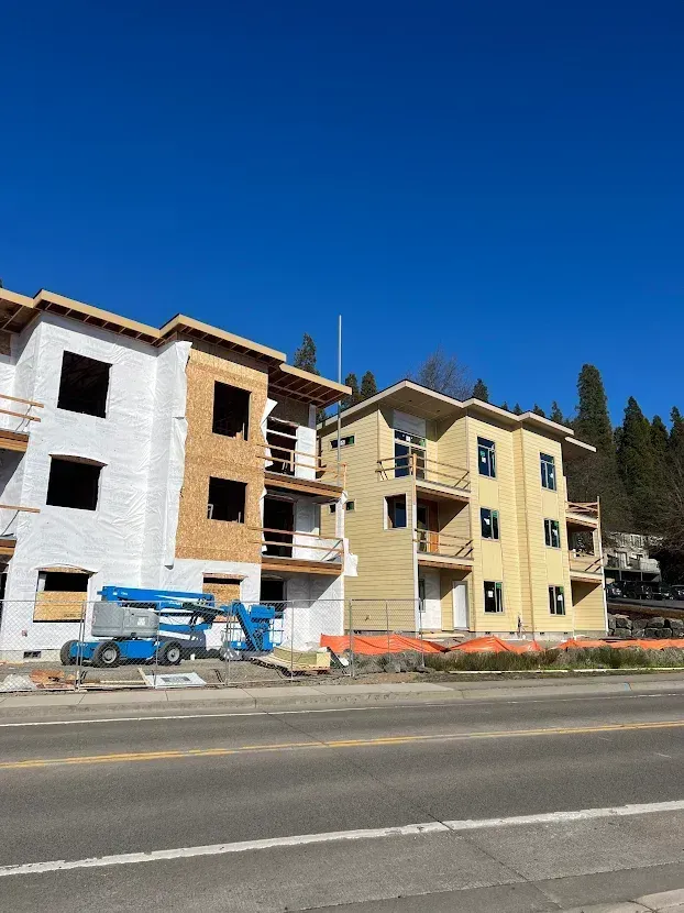 A building under construction with a blue sky in the background
