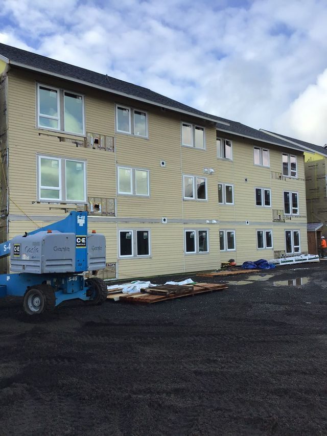 A large building with a lot of windows is being built