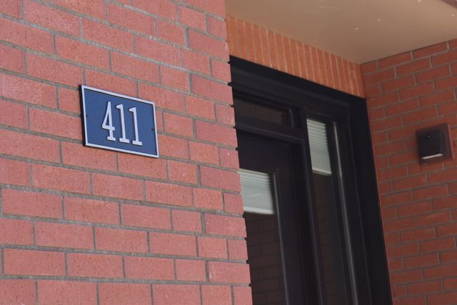 A brick building with the number 411 on it