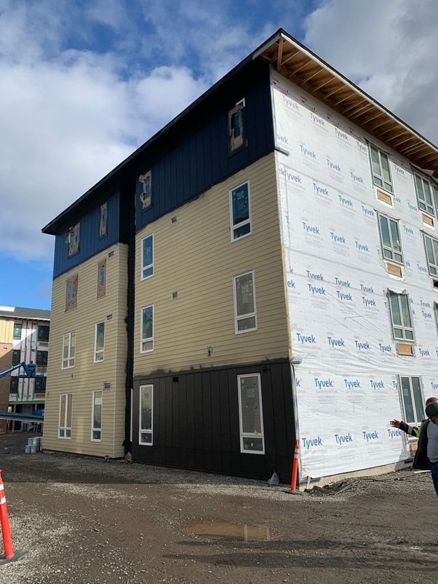 A large building with a lot of windows is being built.