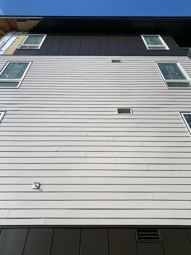 Looking up at a building with a lot of windows
