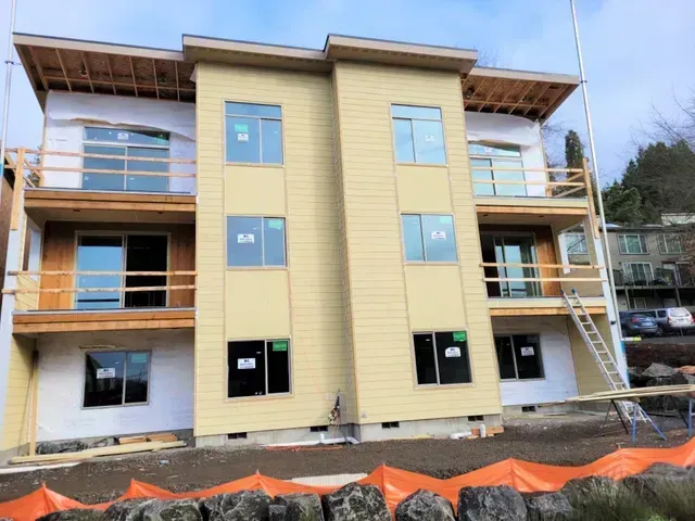 A large building under construction with a lot of windows