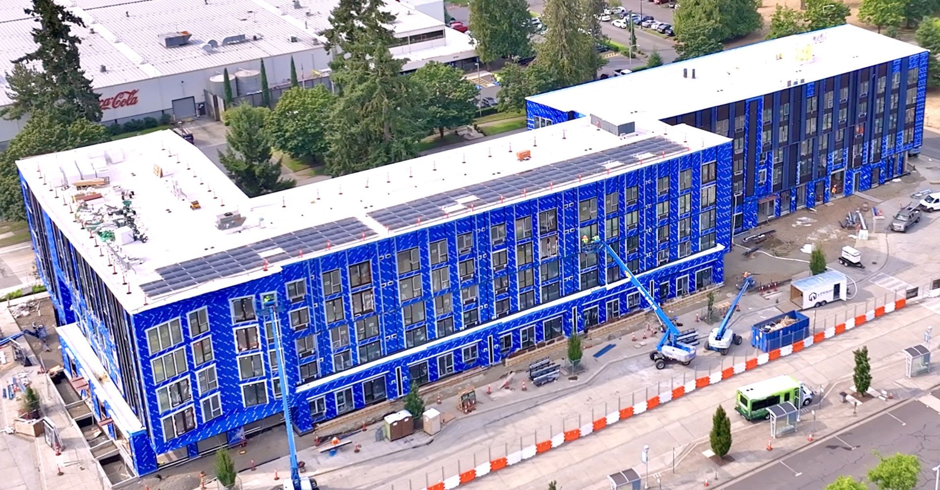 A large building with a lot of windows is being built