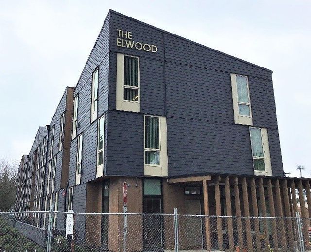 A large building with a fence around it is called the elwood.