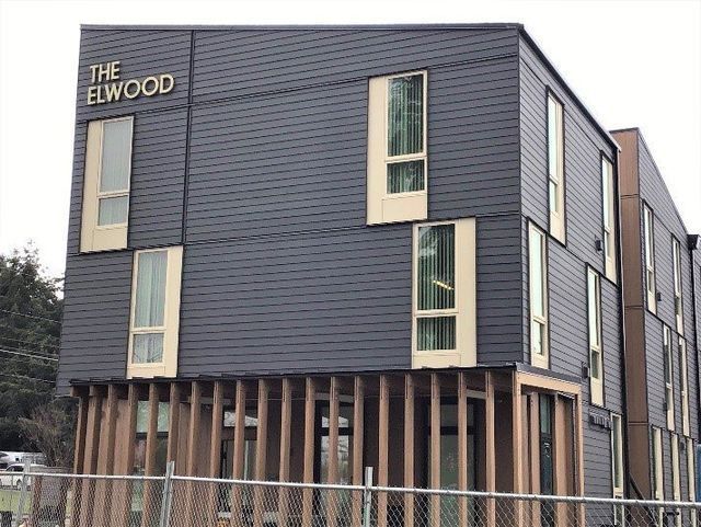 A large building with a lot of windows and the word the elwood on it.