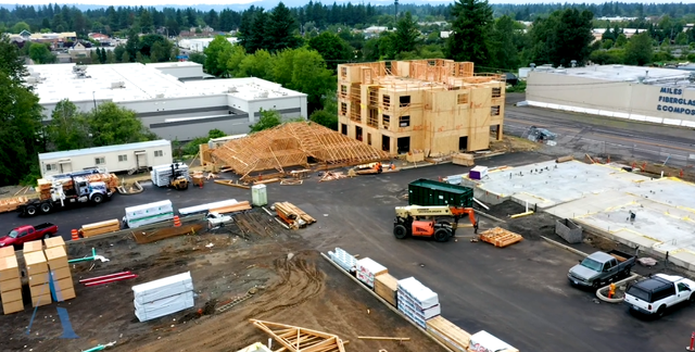 An aerial view of a construction site with a building under construction.