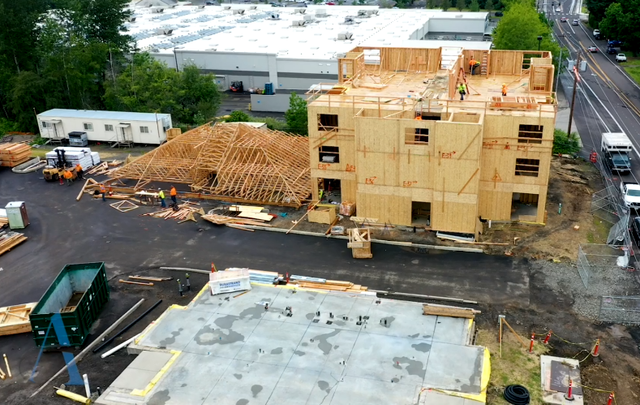 An aerial view of a large building under construction