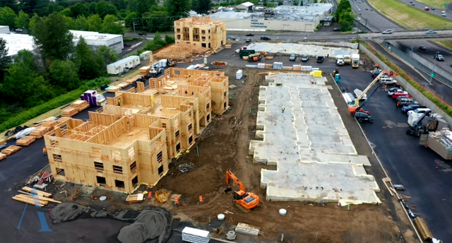An aerial view of a large building under construction.