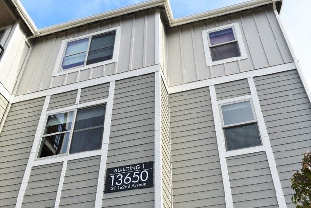 A building with a sign that says 13650 on it