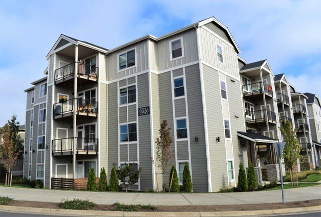 A large apartment building with a lot of windows and balconies