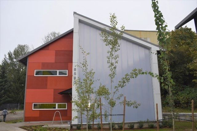 A red and white building with trees in front of it