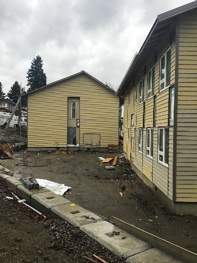 A couple of buildings that are being built next to each other.