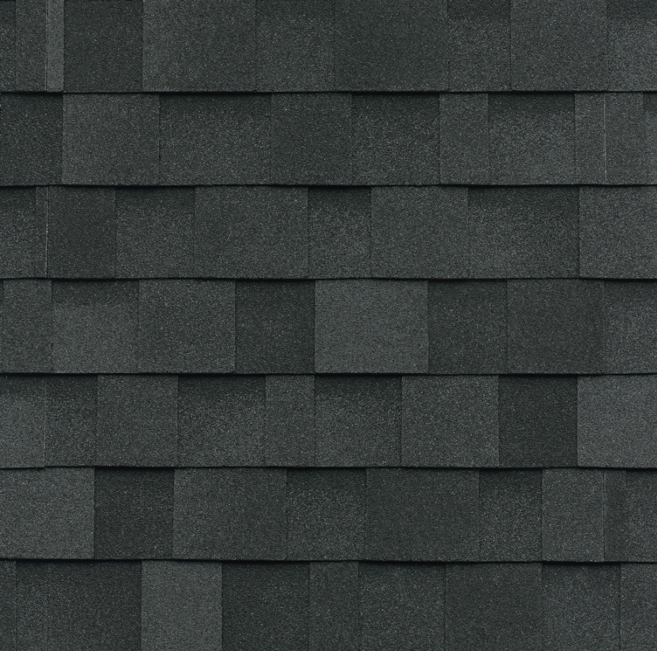 Close-up of architectural asphalt shingles showing a dimensional laminated profile for improved appearance and durability.