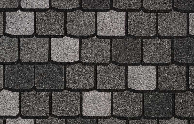 Close-up of premium designer asphalt shingles showing a deeper dimensional pattern and enhanced roof appearance.