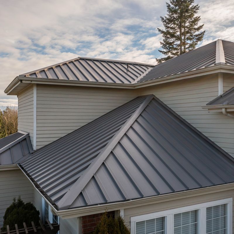 Standing seam metal roofing installed on a residential home showing a durable premium metal roofing system.