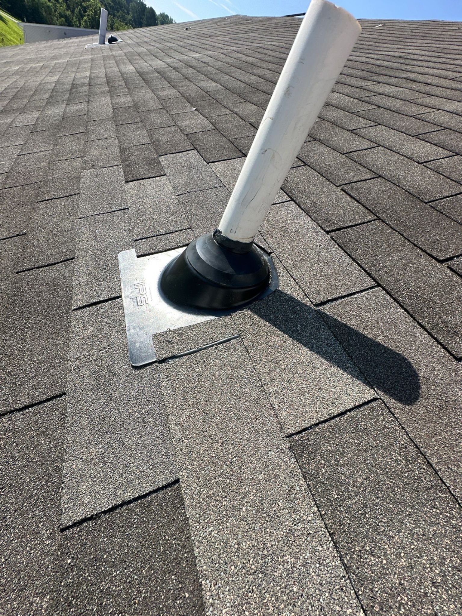 Lifetime Tools pipe boot installed on an asphalt shingle roof to provide durable protection around a roof penetration.