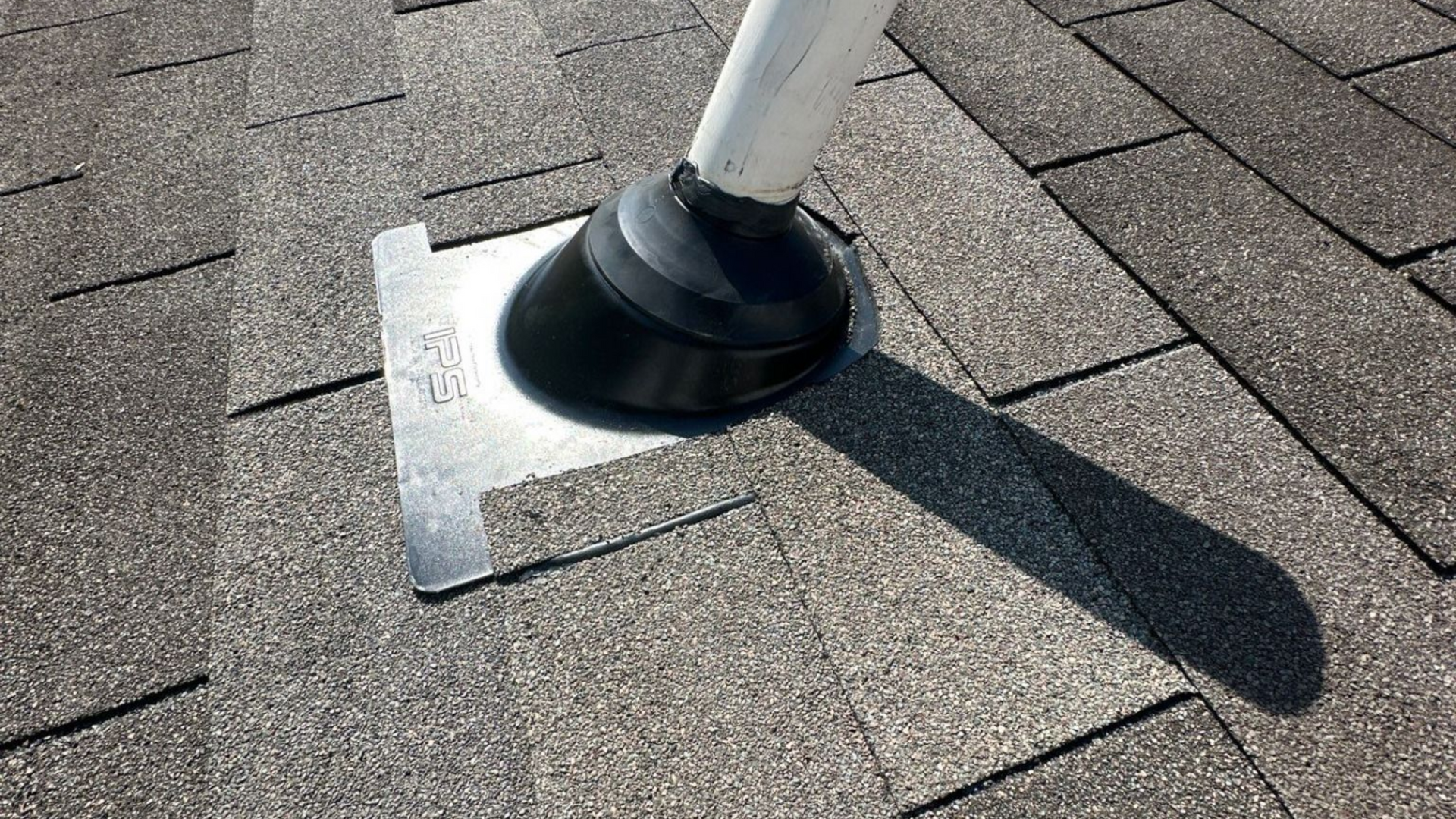 Lifetime Tools pipe boot installed on an asphalt shingle roof to provide durable protection around a plumbing vent penetration.