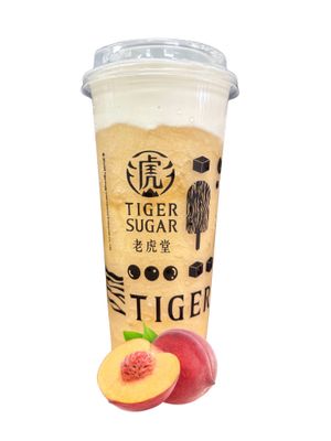 Tiger Sugar peach drink with fruit, layered in a clear plastic cup.
