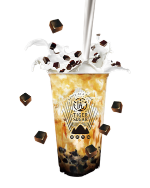 Tiger Sugar brown sugar boba drink with milk being poured, dark boba, and scattered sugar cubes.