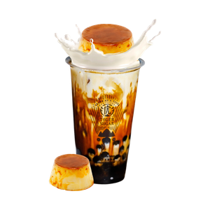 Brown sugar milk tea with flan on top and on the side. Milk splash visible.