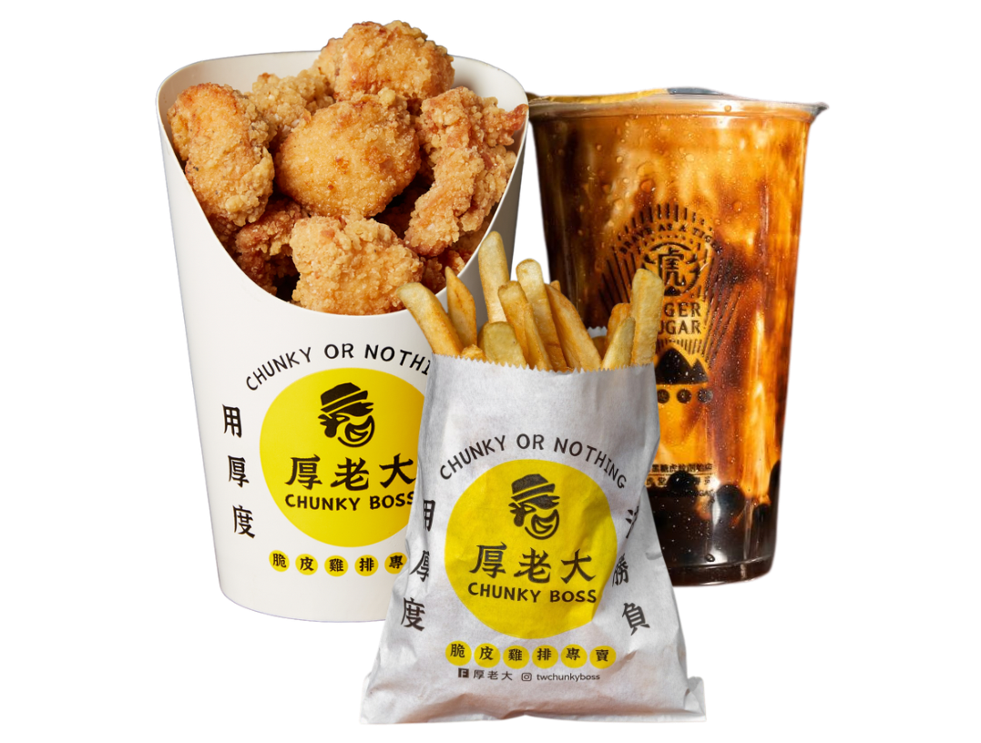 Fried chicken bites, french fries, and bubble tea from a restaurant with yellow branding.