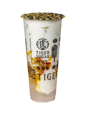 Tiger Sugar drink in a clear plastic cup, with white and brown layers.
