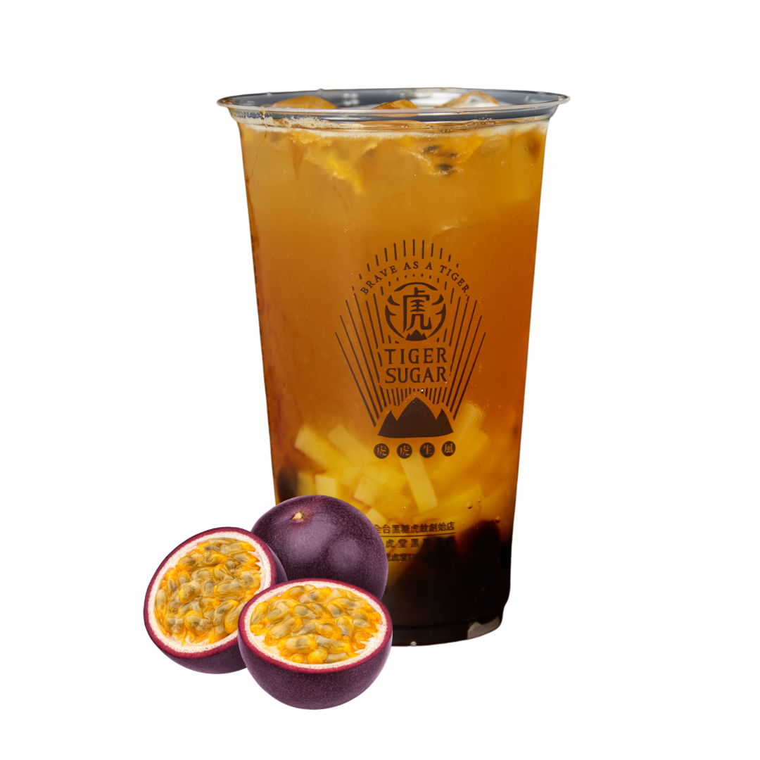 Passion fruit iced tea with passion fruits beside the cup.