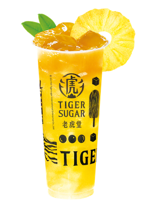 Tiger Sugar pineapple drink in a tall cup with a pineapple slice and leaves.